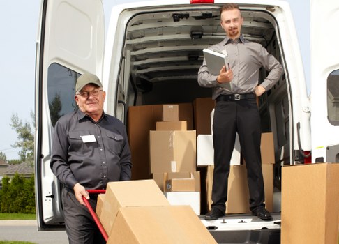 Local removals team handling furniture near Old Malden streets