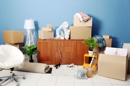 Local house removal service in Old Malden with moving van and packed boxes