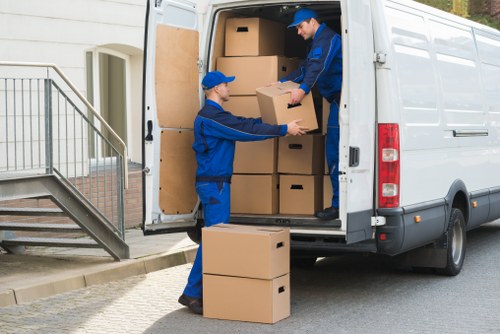 Packed boxes and furniture arranged for local removals in Old Malden