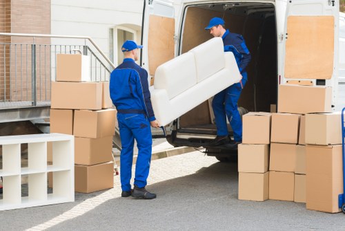 Packed boxes and furniture ready for local removals in Old Malden