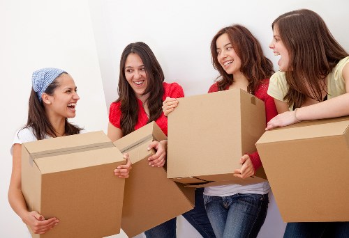 Professional movers handling household items during an Old Malden move