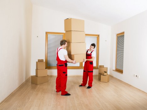Organised house move with boxes and furniture in a moving van